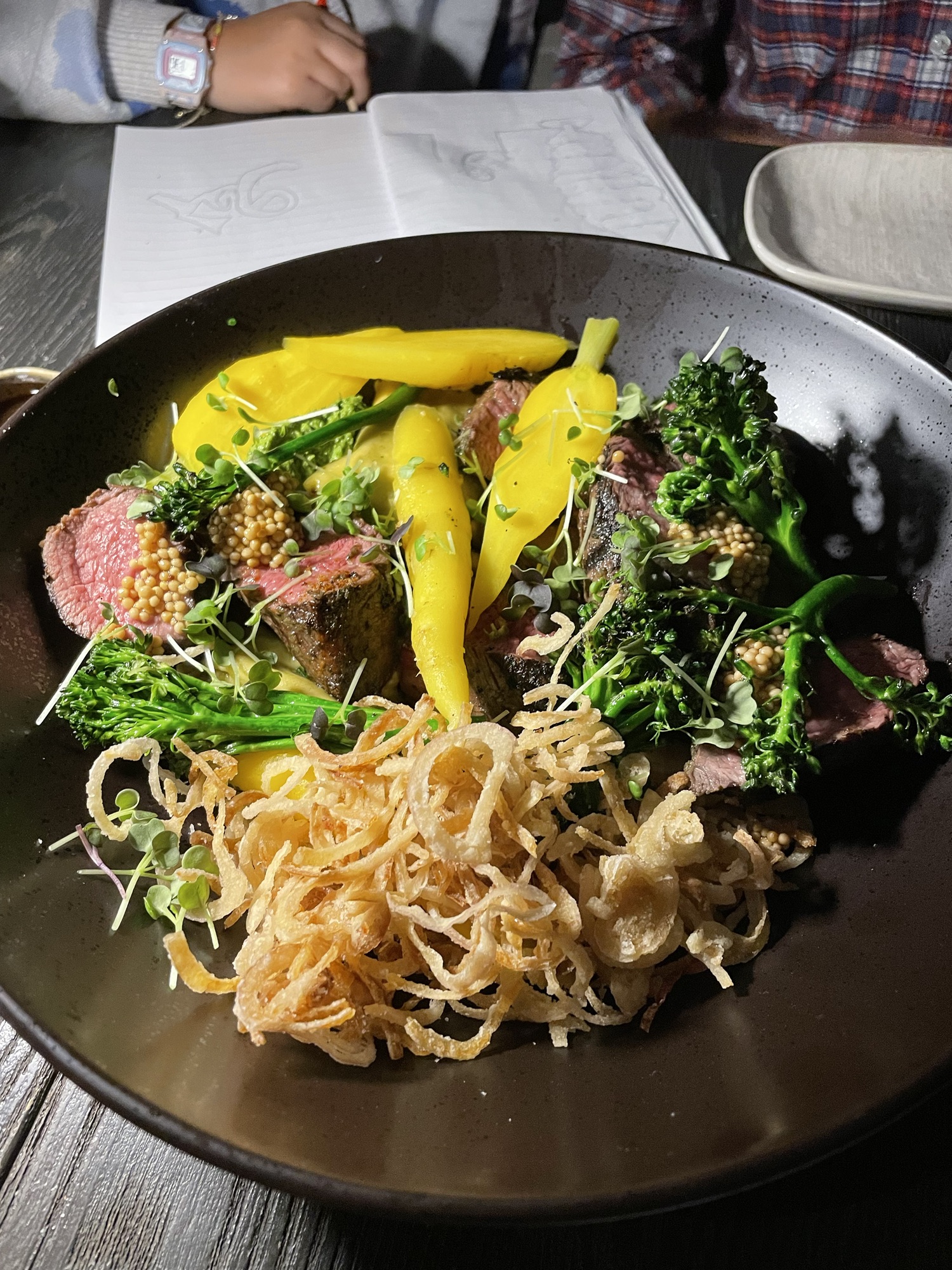 steak with blue cheese, carrots, broccoli, and crispy shallots at L'Orygine